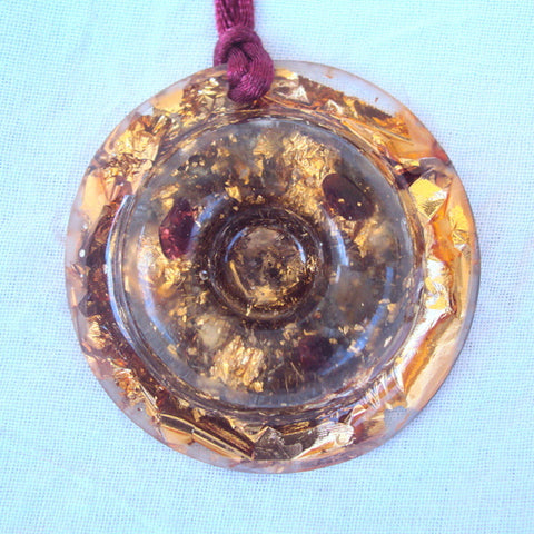 Golden torus disc, garnet and rose quartz