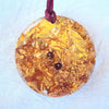 Golden torus disc, garnet and rose quartz